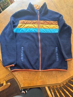cotopaxi Navy Puffer-Trim Fleece Jacket with Aqua, Mustard, and Brown Stripes